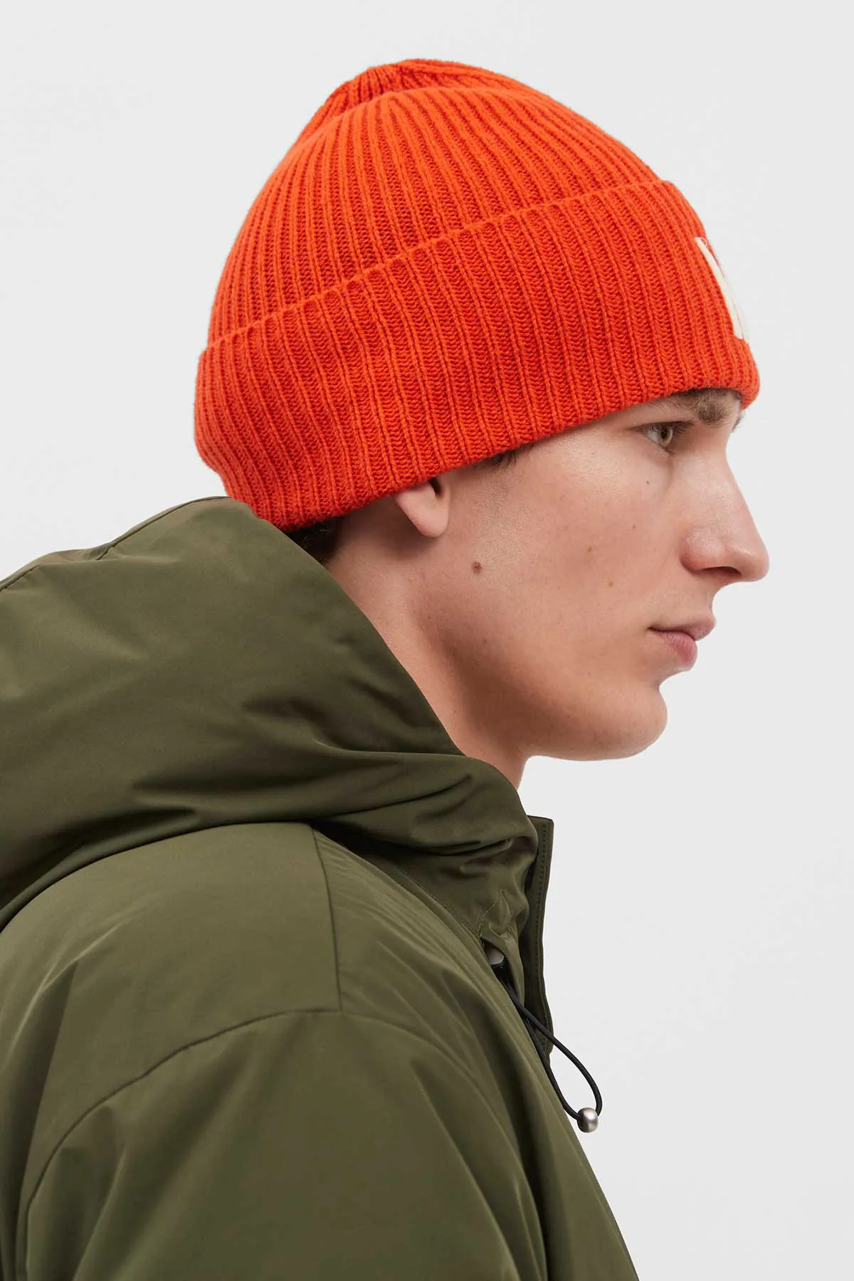 Norse Projects Merino Lambswool Rib N Logo Beanie in Blood Orange