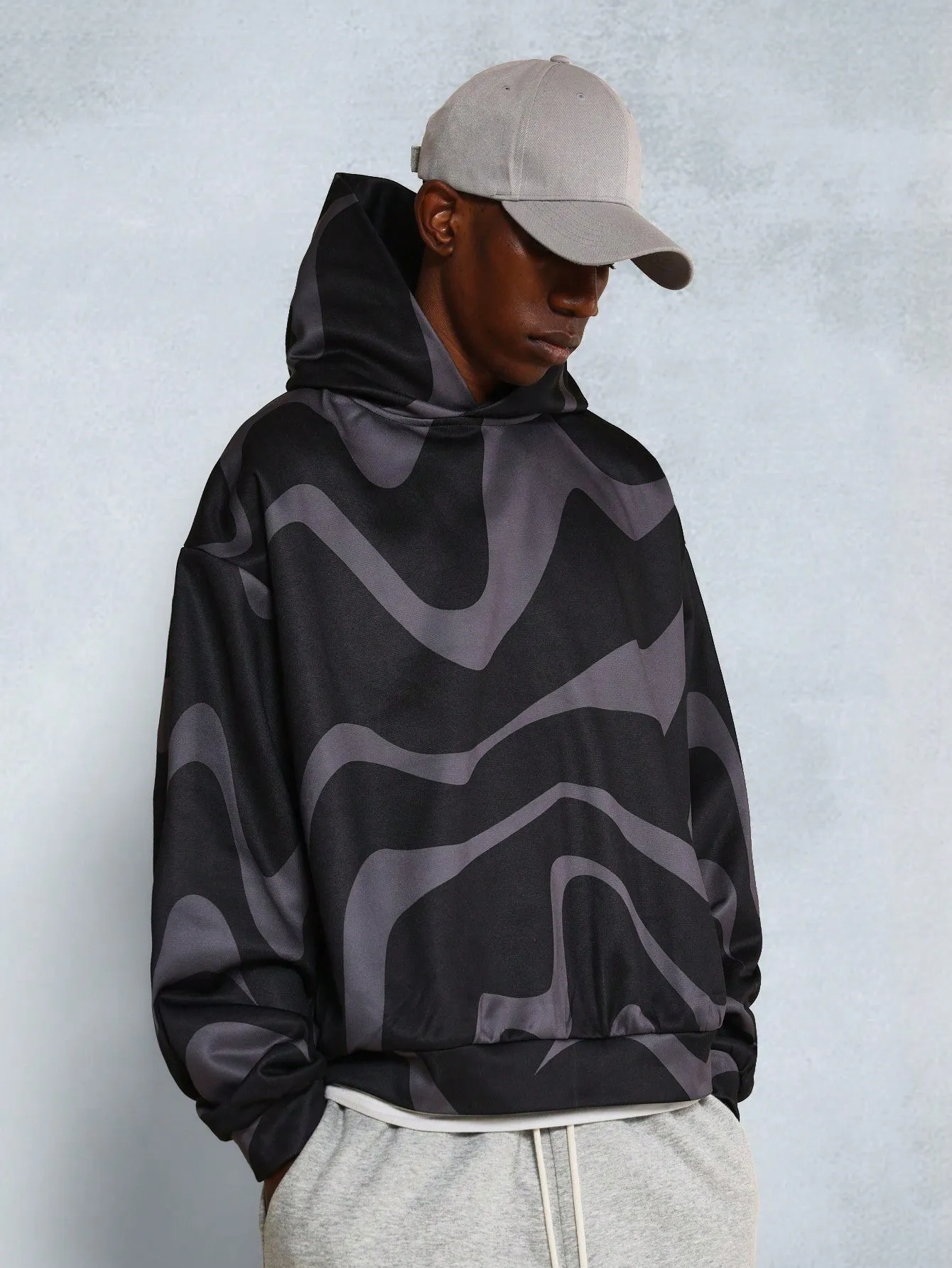 Oversized Fit Side Pocket Hoodie With All Over Swirl Print